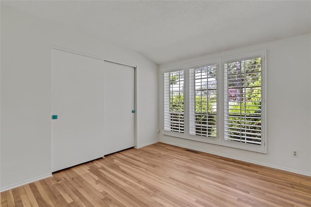 10014 Aldred Dr, Sunset Hills, MO 63128 - unfurnished bedroom with light wood-style flooring, a closet, and baseboards