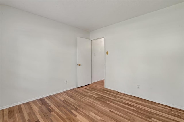 10014 Aldred Dr, Sunset Hills, MO 63128 - spare room featuring light wood-style flooring and baseboards