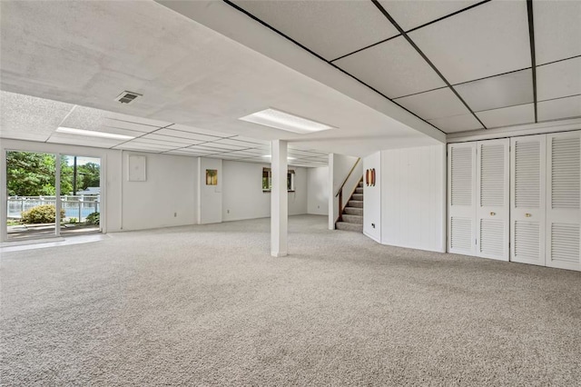 10014 Aldred Dr, Sunset Hills, MO 63128 - below grade area with carpet, stairs, and a drop ceiling