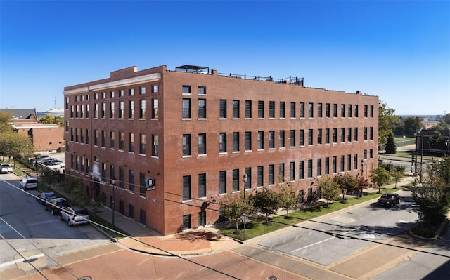 view of property featuring uncovered parking