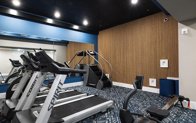 gym with baseboards, carpet, and recessed lighting