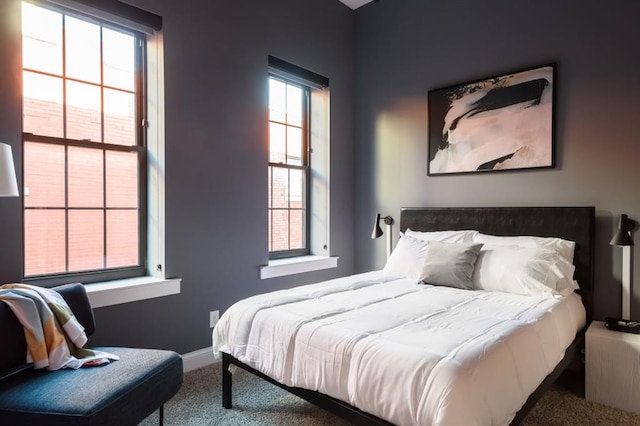 carpeted bedroom with baseboards