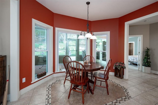 5193 Athlone Ct, Cedar Hill, MO 63016 - dining space featuring inlaid floor details, baseboards, and light tile patterned flooring