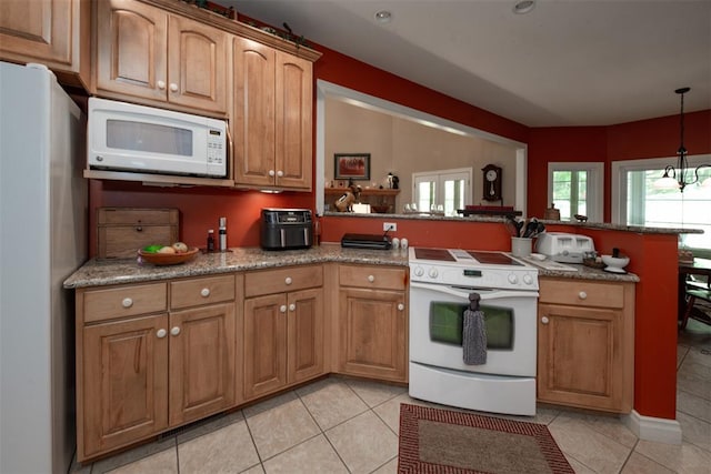 5193 Athlone Ct, Cedar Hill, MO 63016 - kitchen featuring white appliances, a peninsula, light tile patterned floors, and decorative light fixtures