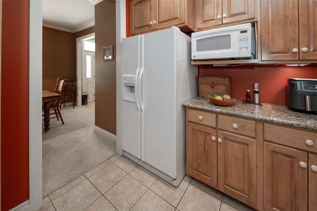 5193 Athlone Ct, Cedar Hill, MO 63016 - kitchen featuring white appliances, crown molding, light carpet, and brown cabinets