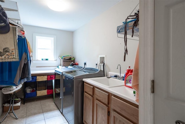 5193 Athlone Ct, Cedar Hill, MO 63016 - laundry area featuring washer and clothes dryer, light tile patterned floors, and cabinet space