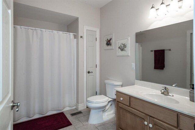 5193 Athlone Ct, Cedar Hill, MO 63016 - bathroom featuring toilet, tile patterned flooring, vanity, and curtained shower