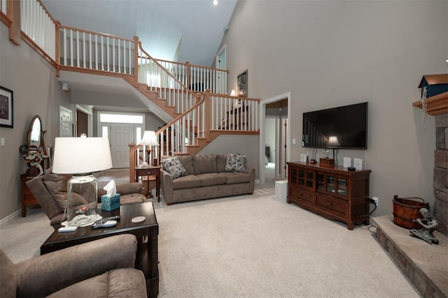 5193 Athlone Ct, Cedar Hill, MO 63016 - carpeted living room featuring a high ceiling, stairway, and baseboards