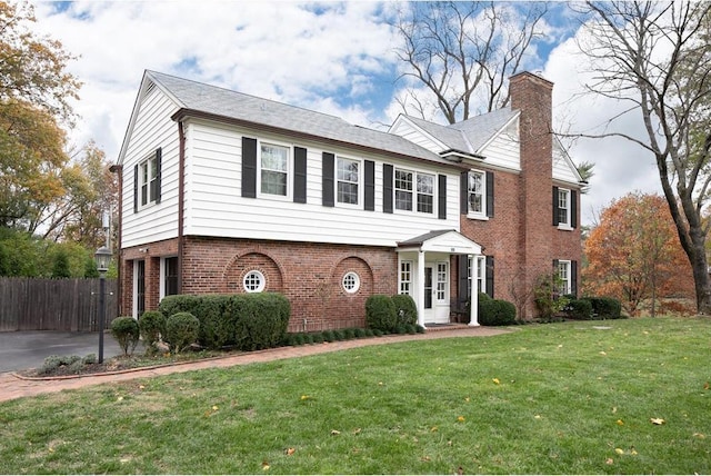 15 Briarcliff Rd, Ladue, MO 63124 - view of front of home with a chimney and brick siding