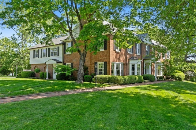 15 Briarcliff Rd, Ladue, MO 63124 - townhome / multi-family property with brick siding and a front lawn
