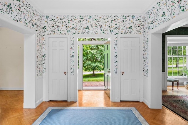 15 Briarcliff Rd, Ladue, MO 63124 - foyer with wallpapered walls, crown molding, baseboards, and wainscoting