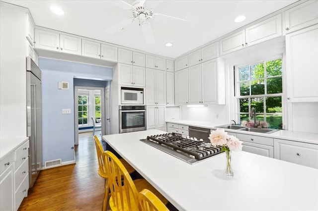 15 Briarcliff Rd, Ladue, MO 63124 - kitchen with stainless steel appliances, a sink, plenty of natural light, ceiling fan, and recessed lighting