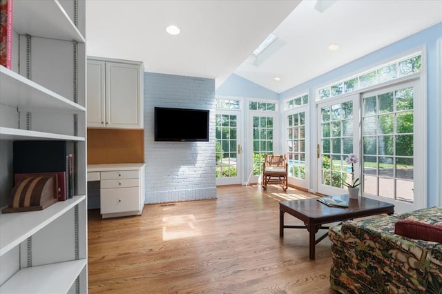 15 Briarcliff Rd, Ladue, MO 63124 - living room with lofted ceiling and light wood-style floors