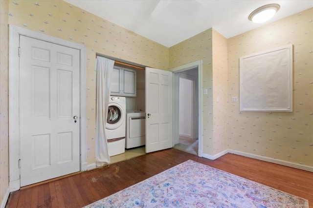15 Briarcliff Rd, Ladue, MO 63124 - washroom with washer / clothes dryer, cabinet space, hardwood / wood-style flooring, wallpapered walls, and baseboards