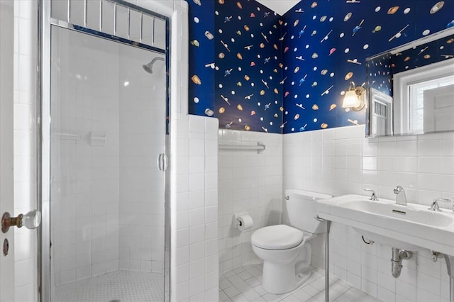 15 Briarcliff Rd, Ladue, MO 63124 - full bathroom with a stall shower, tile walls, wainscoting, tile patterned flooring, and toilet