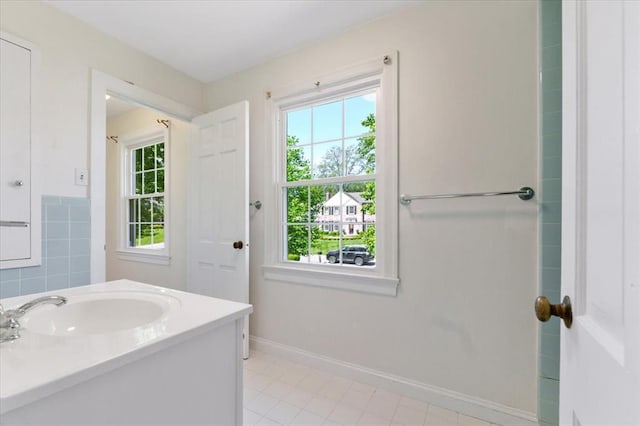 15 Briarcliff Rd, Ladue, MO 63124 - bathroom with tile patterned floors, baseboards, and vanity