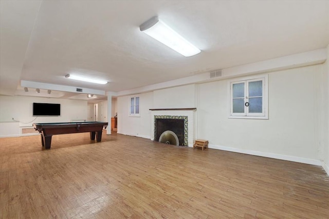 15 Briarcliff Rd, Ladue, MO 63124 - playroom with wood finished floors, a fireplace, billiards table, and baseboards