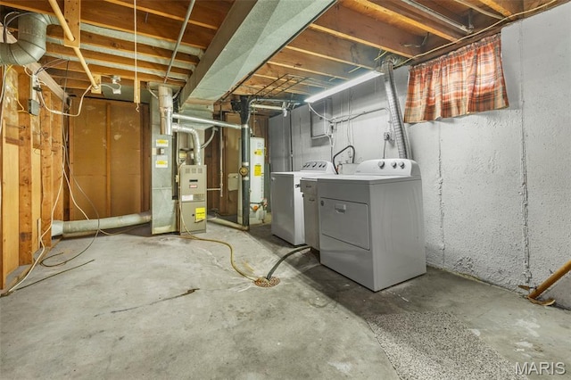 165 Saint Daniel Ln, Florissant, MO 63031 - unfinished below grade area featuring separate washer and dryer, gas water heater, and heating unit