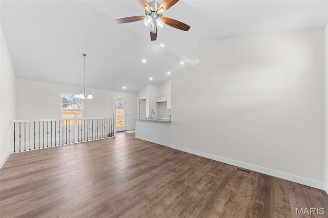280 Railroad St, Moscow Mills, MO 63362 - unfurnished living room with a chandelier, ceiling fan, vaulted ceiling, wood finished floors, and recessed lighting