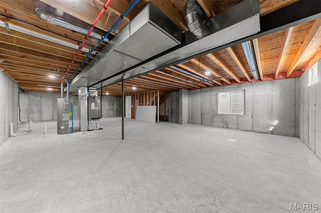 280 Railroad St, Moscow Mills, MO 63362 - unfinished basement featuring electric water heater and heating unit