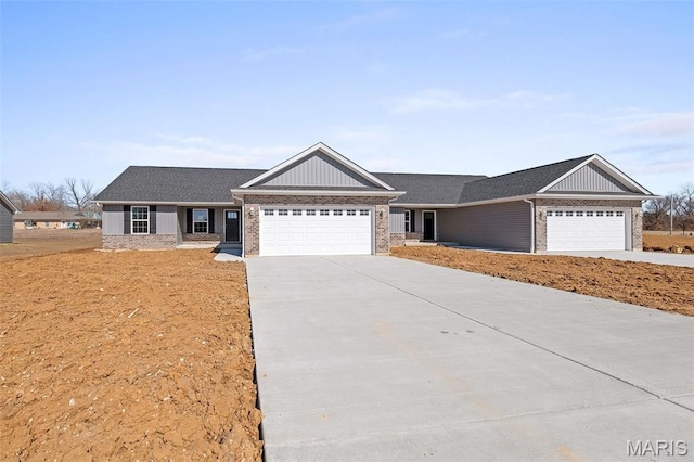 280 Railroad St, Moscow Mills, MO 63362 - ranch-style house with an attached garage, concrete driveway, brick siding, and board and batten siding