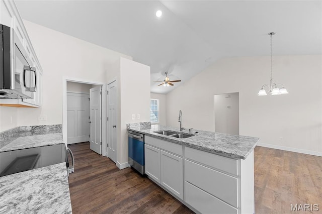 280 Railroad St, Moscow Mills, MO 63362 - kitchen with appliances with stainless steel finishes, vaulted ceiling, a peninsula, dark wood-style floors, and white cabinetry