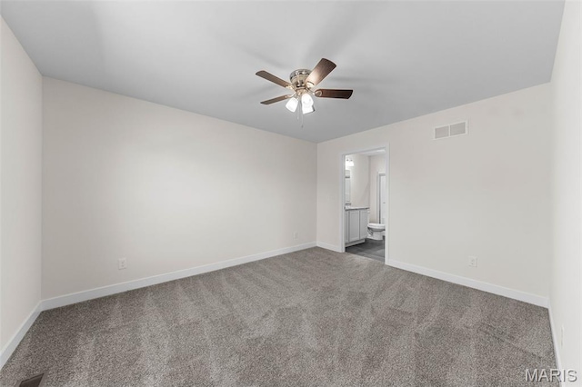 280 Railroad St, Moscow Mills, MO 63362 - spare room featuring a ceiling fan and dark colored carpet