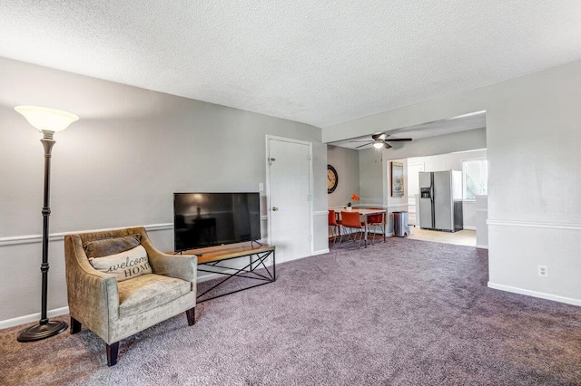 1843 Gascony Parc Dr Unit 1843, Lake St Louis, MO 63367 - living room with carpet flooring, a ceiling fan, a textured ceiling, and baseboards