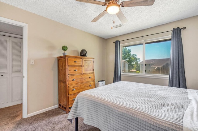 1843 Gascony Parc Dr Unit 1843, Lake St Louis, MO 63367 - carpeted bedroom featuring a textured ceiling, baseboards, and ceiling fan