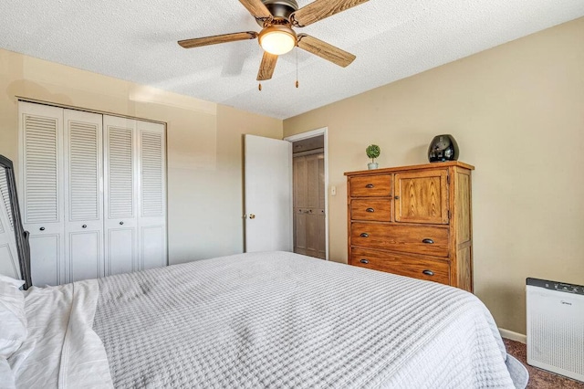 1843 Gascony Parc Dr Unit 1843, Lake St Louis, MO 63367 - bedroom featuring carpet floors, a textured ceiling, a closet, a ceiling fan, and baseboards