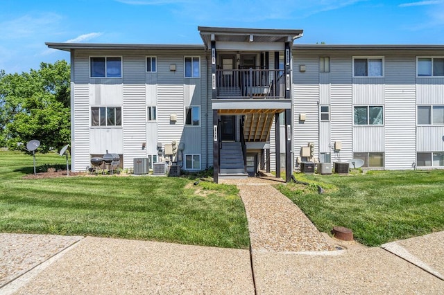 1843 Gascony Parc Dr Unit 1843, Lake St Louis, MO 63367 - back of house featuring a balcony, a yard, and central AC unit