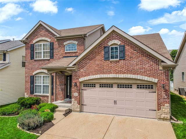 521 Newkirk Cir, Saint Charles, MO 63303 - traditional-style house with brick siding, driveway, a shingled roof, and cooling unit
