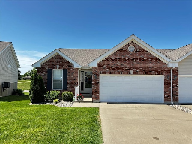 view of front of home with a garage, driveway, a front lawn, and brick siding