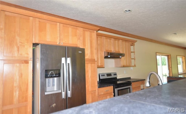 11370 County Road 5220, Rolla, MO 65401 - kitchen with appliances with stainless steel finishes, a textured ceiling, under cabinet range hood, dark countertops, and crown molding