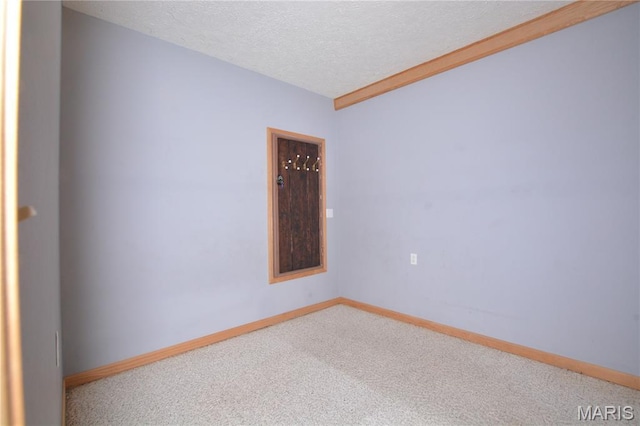 11370 County Road 5220, Rolla, MO 65401 - carpeted empty room featuring a textured ceiling and baseboards