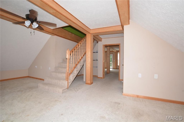 11370 County Road 5220, Rolla, MO 65401 - basement with a textured ceiling, carpet flooring, stairway, and a ceiling fan