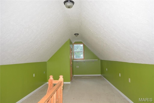 11370 County Road 5220, Rolla, MO 65401 - additional living space featuring a textured ceiling, lofted ceiling, and light carpet