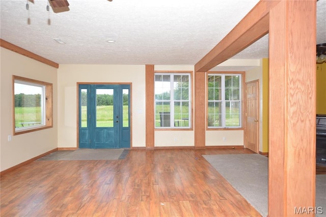 11370 County Road 5220, Rolla, MO 65401 - entrance foyer with a textured ceiling, wood finished floors, and a ceiling fan