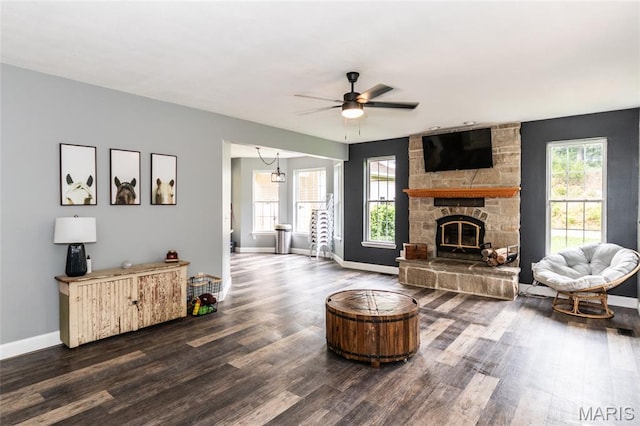 7011 Browns Ford Rd, Dittmer, MO 63023 - living room featuring a ceiling fan, dark wood finished floors, a fireplace, and a chandelier