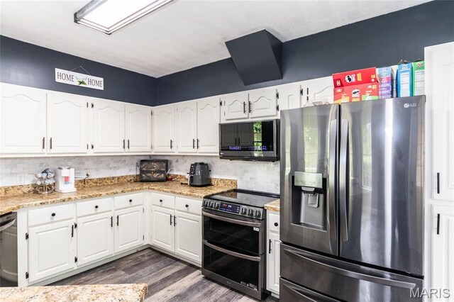 7011 Browns Ford Rd, Dittmer, MO 63023 - kitchen with appliances with stainless steel finishes, white cabinets, dark wood-type flooring, tasteful backsplash, and light stone countertops