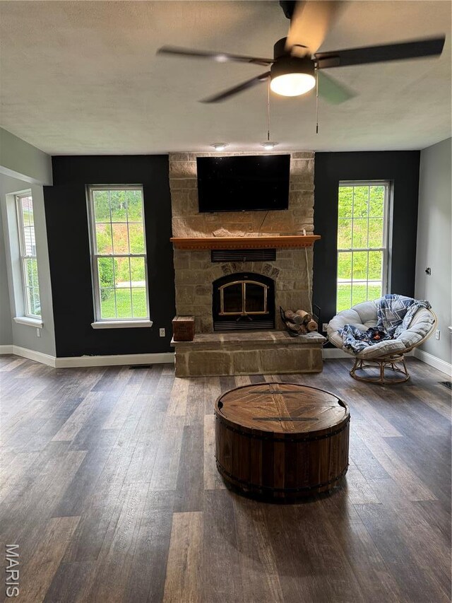 7011 Browns Ford Rd, Dittmer, MO 63023 - living room with wood-type flooring, a ceiling fan, and a stone fireplace