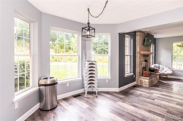 7011 Browns Ford Rd, Dittmer, MO 63023 - dining space featuring wood finished floors and a fireplace