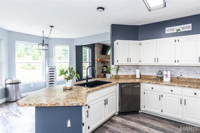7011 Browns Ford Rd, Dittmer, MO 63023 - kitchen with a peninsula, stainless steel dishwasher, white cabinetry, backsplash, and dark wood-style flooring