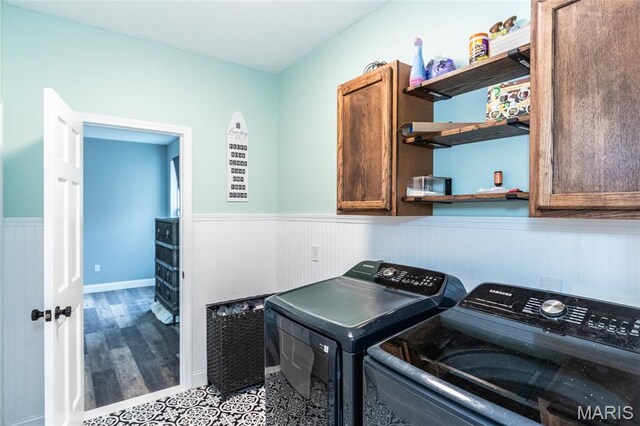 7011 Browns Ford Rd, Dittmer, MO 63023 - laundry room with cabinet space, wainscoting, washer and dryer, and wood finished floors