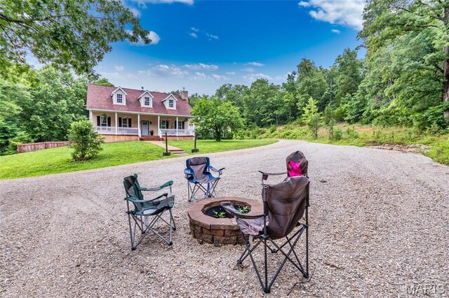 7011 Browns Ford Rd, Dittmer, MO 63023 - view of property's community with an outdoor fire pit and a yard