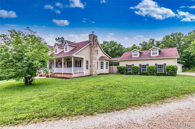 7011 Browns Ford Rd, Dittmer, MO 63023 - cape cod-style house with covered porch, a front lawn, a chimney, and a shingled roof