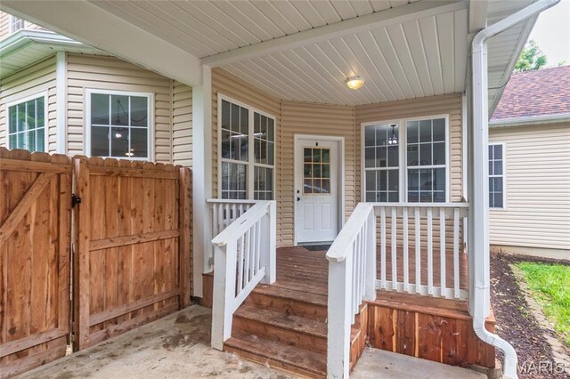 7011 Browns Ford Rd, Dittmer, MO 63023 - view of exterior entry featuring roof with shingles and a gate
