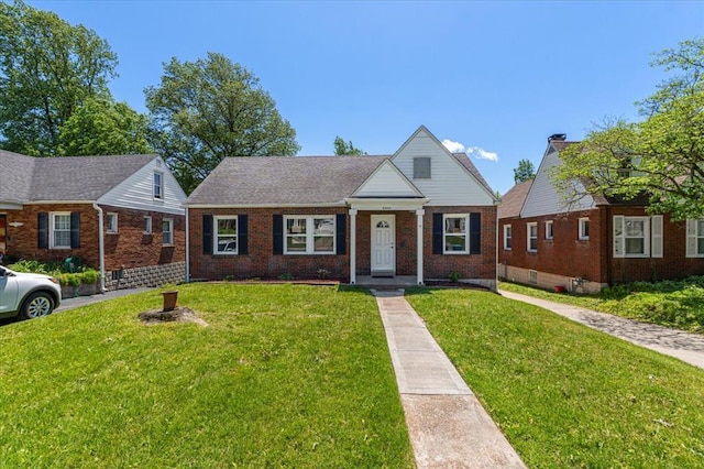 8908 Apache Ln, Overland, MO 63114 - bungalow-style house with brick siding and a front lawn