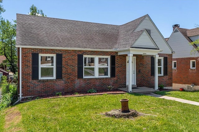 8908 Apache Ln, Overland, MO 63114 - view of front of house featuring brick siding and a shingled roof