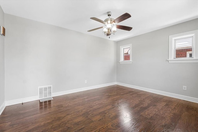 8908 Apache Ln, Overland, MO 63114 - empty room featuring ceiling fan, wood finished floors, and baseboards